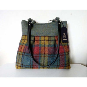 Green milti check Harris Tweed pleated tote bag with black leather shoulder straps and a black lining with a zipped pocket