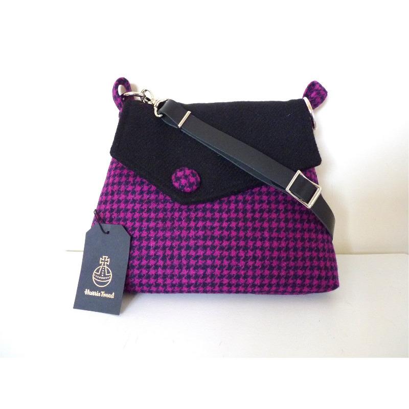 Cerise & black houndstoth check Harris Tweed shoulder bag with an adjustable black leather strap and a black lining with a zipped pocket