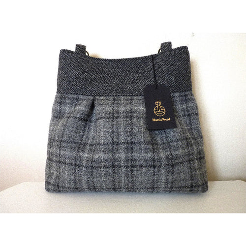 Grey check Harris Tweed pleated tote bag with black leather shoulder straps and a black lining with a zipped pocket