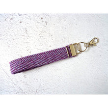 Load image into Gallery viewer, Harris Tweed wristlet kering with a clip - purple herringbone
